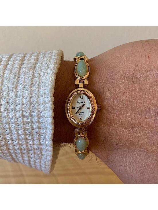 Accessories - Dainty Gold watch with light blue jade stone opal accents. Item works tell time